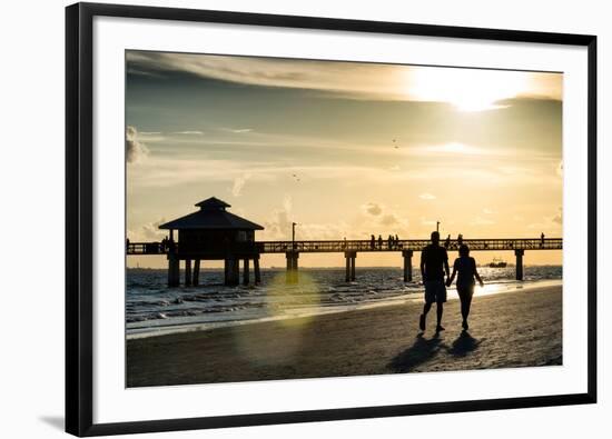 Loving Couple walking along the Beach at Sunset-Philippe Hugonnard-Framed Photographic Print