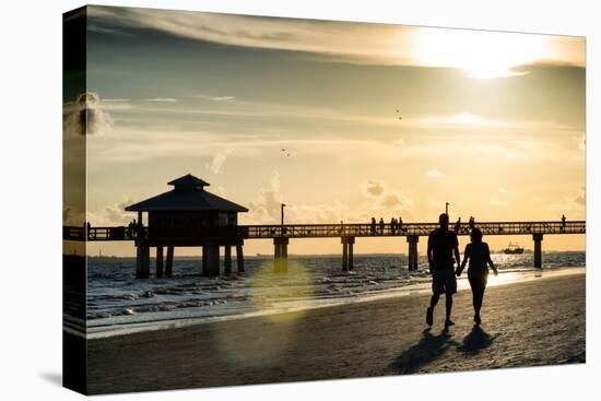 Loving Couple walking along the Beach at Sunset-Philippe Hugonnard-Stretched Canvas