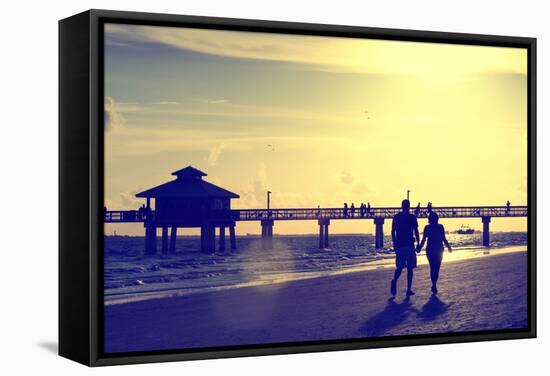 Loving Couple walking along the Beach at Sunset-Philippe Hugonnard-Framed Stretched Canvas