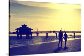 Loving Couple walking along the Beach at Sunset-Philippe Hugonnard-Stretched Canvas