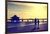 Loving Couple walking along the Beach at Sunset-Philippe Hugonnard-Framed Photographic Print