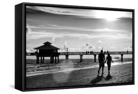 Loving Couple walking along the Beach at Sunset-Philippe Hugonnard-Framed Stretched Canvas