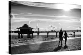 Loving Couple walking along the Beach at Sunset-Philippe Hugonnard-Stretched Canvas