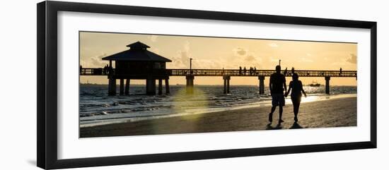 Loving Couple walking along the Beach at Sunset-Philippe Hugonnard-Framed Photographic Print