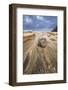 Low angle of a stream flowing around a rock heading into the ocean with stormy skies and a rainbow-Sheila Haddad-Framed Photographic Print