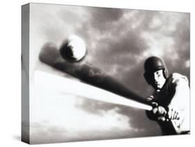 Low Angle View of a Baseball Player Swinging a Baseball Bat-null-Stretched Canvas