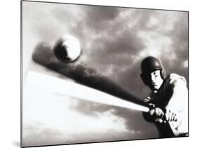 Low Angle View of a Baseball Player Swinging a Baseball Bat-null-Mounted Photographic Print