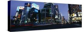 Low Angle View of a Building Lit Up at Dusk, Tokyo Prefecture, Japan-null-Stretched Canvas