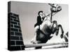 Low Angle View of a Jockey And a Horse Jumping Over a Hurdle-null-Stretched Canvas