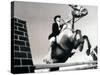 Low Angle View of a Jockey And a Horse Jumping Over a Hurdle-null-Stretched Canvas