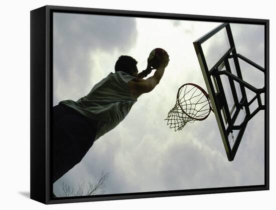 Low Angle View of a Man Shooting a Basket-null-Framed Stretched Canvas