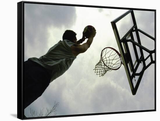 Low Angle View of a Man Shooting a Basket-null-Framed Stretched Canvas