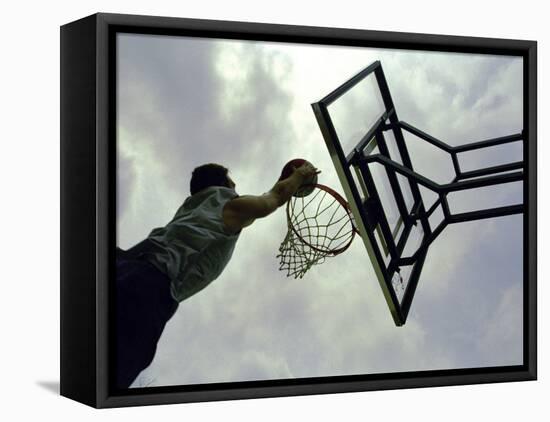 Low Angle View of a Man Shooting a Basket-null-Framed Stretched Canvas