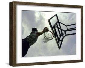 Low Angle View of a Man Shooting a Basket-null-Framed Premium Photographic Print