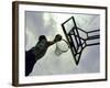 Low Angle View of a Man Shooting a Basket-null-Framed Photographic Print