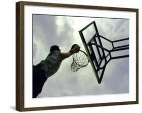 Low Angle View of a Man Shooting a Basket-null-Framed Photographic Print