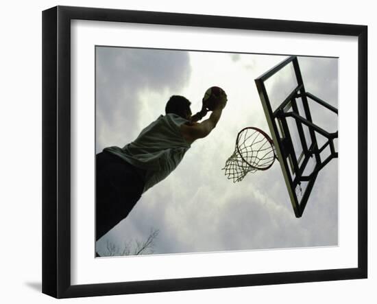 Low Angle View of a Man Shooting a Basket-null-Framed Photographic Print