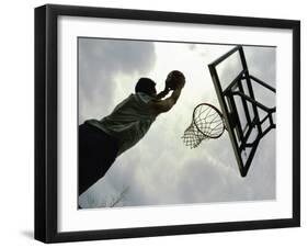 Low Angle View of a Man Shooting a Basket-null-Framed Photographic Print