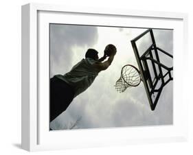 Low Angle View of a Man Shooting a Basket-null-Framed Photographic Print