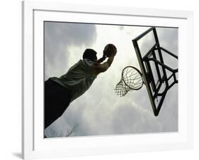 Low Angle View of a Man Shooting a Basket-null-Framed Photographic Print