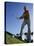 Low Angle View of a Senior Man Swinging a Golf Club-null-Stretched Canvas