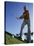 Low Angle View of a Senior Man Swinging a Golf Club-null-Stretched Canvas