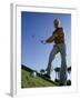 Low Angle View of a Senior Man Swinging a Golf Club-null-Framed Premium Photographic Print