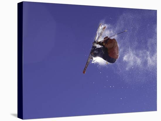 Low Angle View of a Skier in Mid Air-null-Stretched Canvas