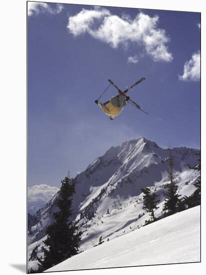 Low Angle View of a Skier in Mid Air-null-Mounted Photographic Print