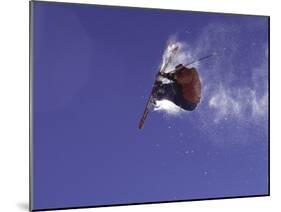 Low Angle View of a Skier in Mid Air-null-Mounted Photographic Print