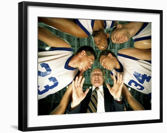 Low Angle View of a Team and Their Coach in a Huddle-null-Framed Photographic Print