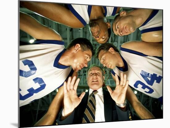 Low Angle View of a Team and Their Coach in a Huddle-null-Mounted Photographic Print