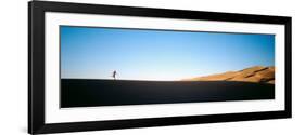 Low Angle View of a Woman Running in the Desert, Great Sand Dunes National Monument, Colorado, USA-null-Framed Photographic Print