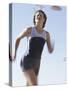 Low Angle View of a Woman Running-null-Stretched Canvas