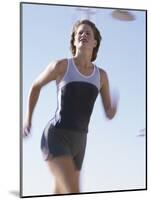 Low Angle View of a Woman Running-null-Mounted Photographic Print