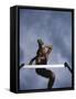 Low Angle View of a Young Man Jumping over a Hurdle-null-Framed Stretched Canvas