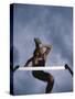 Low Angle View of a Young Man Jumping over a Hurdle-null-Stretched Canvas