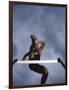 Low Angle View of a Young Man Jumping over a Hurdle-null-Framed Photographic Print