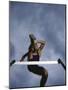 Low Angle View of a Young Man Jumping over a Hurdle-null-Mounted Photographic Print