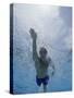 Low Angle View of a Young Man Swimming Underwater-null-Stretched Canvas