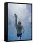 Low Angle View of a Young Man Swimming Underwater-null-Framed Stretched Canvas