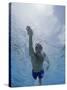 Low Angle View of a Young Man Swimming Underwater-null-Stretched Canvas