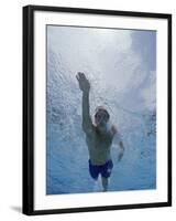 Low Angle View of a Young Man Swimming Underwater-null-Framed Photographic Print