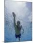 Low Angle View of a Young Man Swimming Underwater-null-Mounted Photographic Print