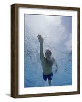 Low Angle View of a Young Man Swimming Underwater-null-Framed Photographic Print