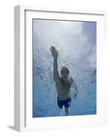 Low Angle View of a Young Man Swimming Underwater-null-Framed Photographic Print