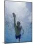 Low Angle View of a Young Man Swimming Underwater-null-Mounted Photographic Print