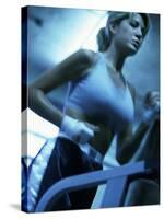 Low Angle View of a Young Woman Running on a Treadmill-null-Stretched Canvas