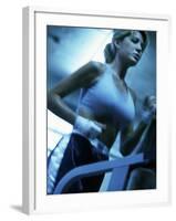 Low Angle View of a Young Woman Running on a Treadmill-null-Framed Photographic Print