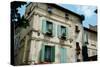 Low Angle View of an Old Building with Flower Pots on Each Window, Rue Des Arenes, Arles-null-Stretched Canvas